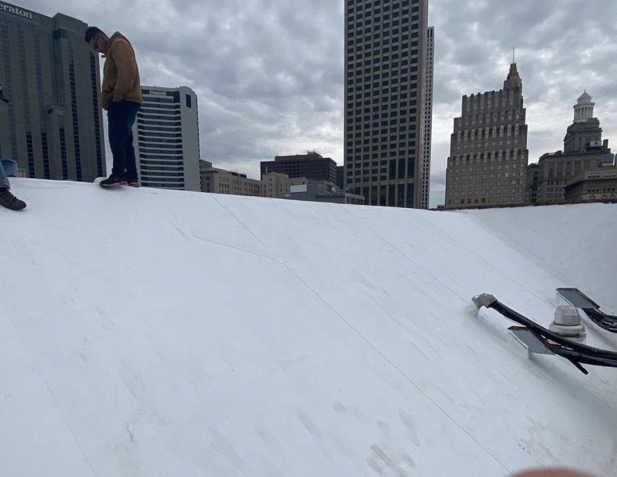 White commercial roof in progress.