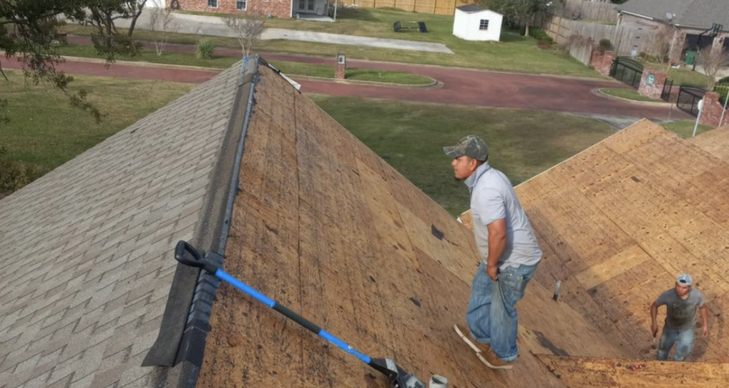 Shingle roof being installed on home.