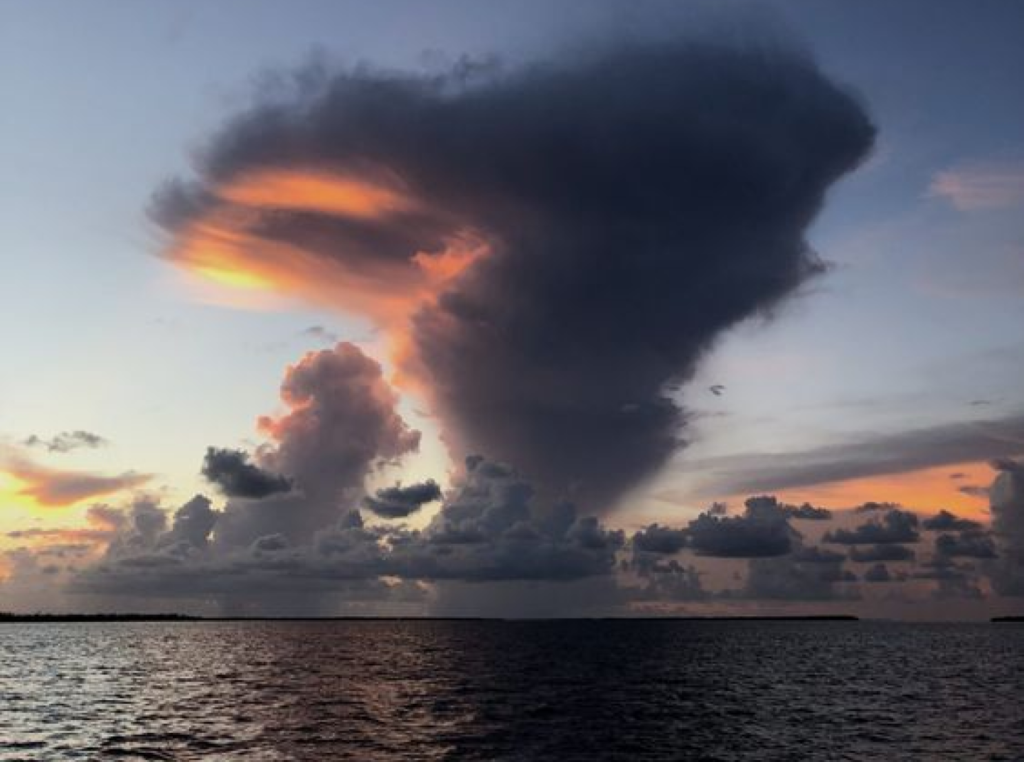 Storm cloud over lake.